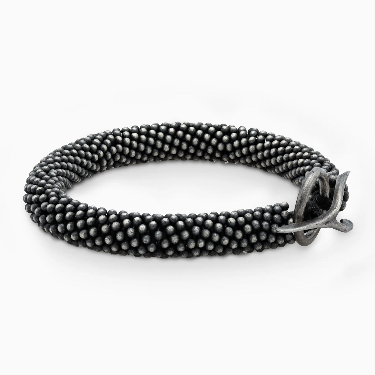 Sterling Silver black textured bracelet featuring a striking silver clasp.