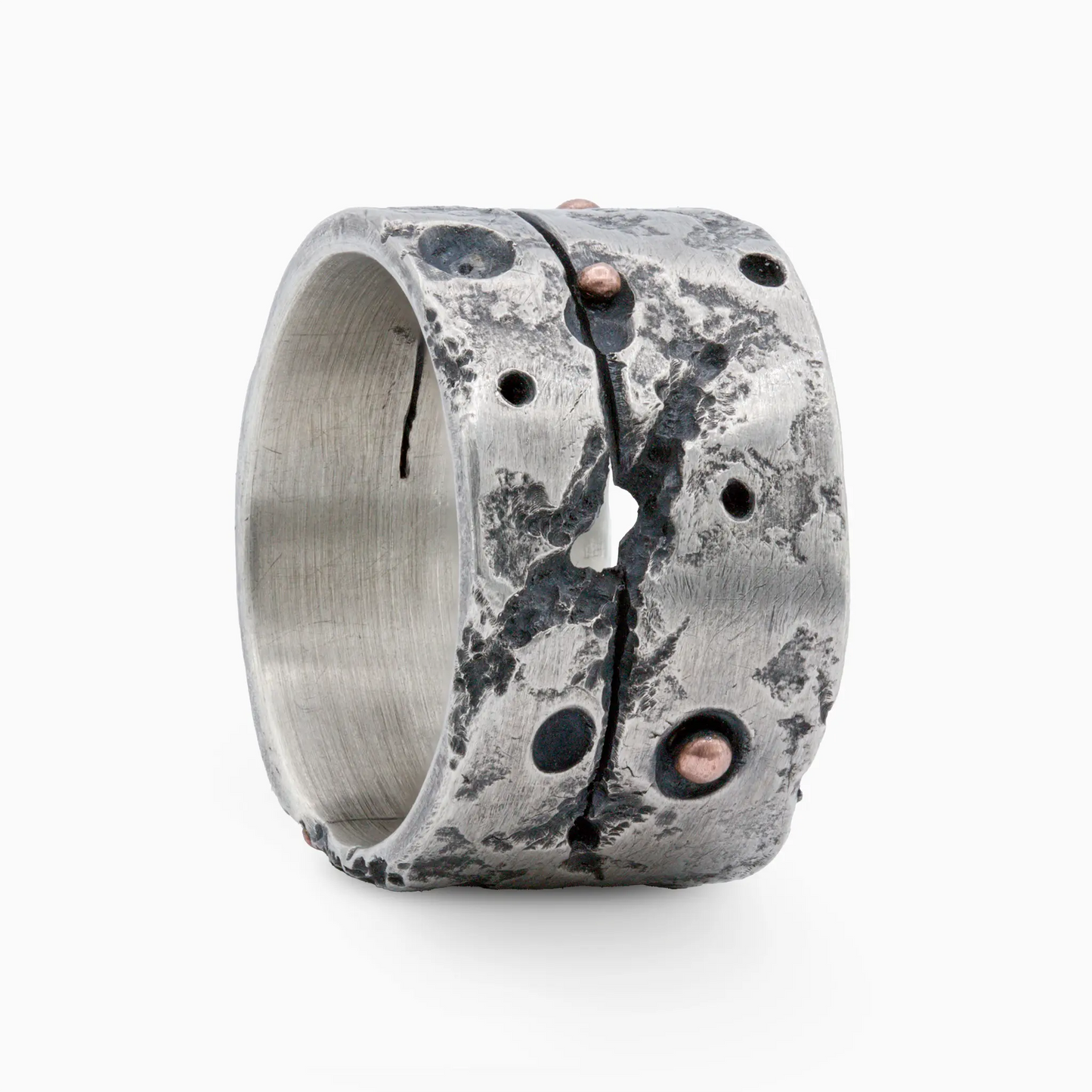 Sterling Silver silver ring with rugged textures, organic cracks, and copper accents, blending raw elegance and modern craft…
