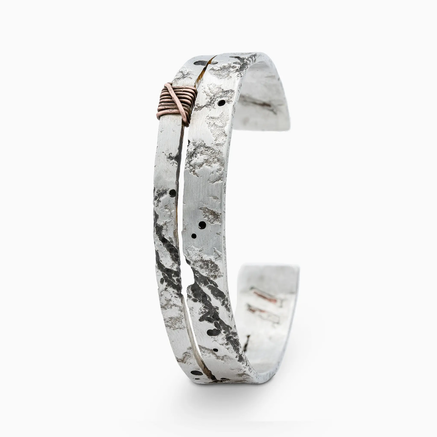 Sterling Silver handcrafted silver bracelet with textured design and unique elements.