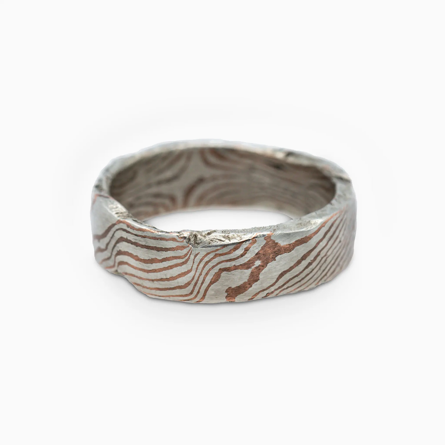 Sterling silver moku Ring lying flat, showcasing its flowing mokume-gane pattern with seamless metal layers.