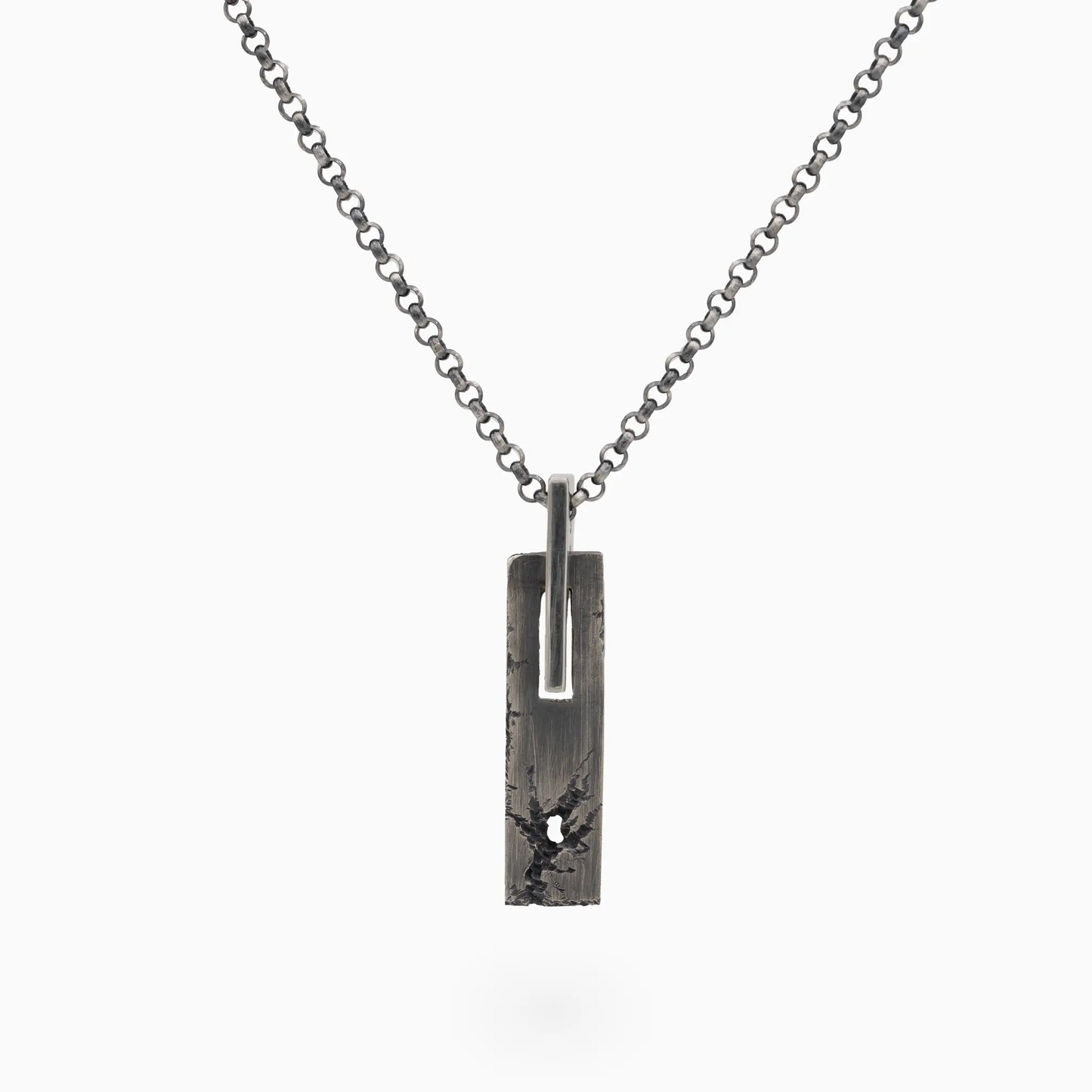 Sterling Silver rectangular textured silver SW-08 pendant with rugged design and small hole, hanging from a silver chain.