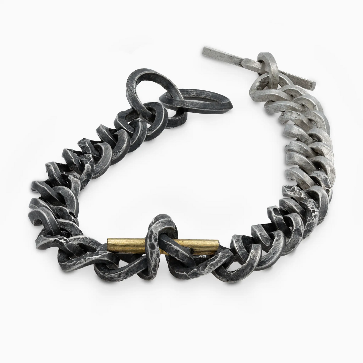 Close-up of the Staff and Chain bracelet, featuring oxidized silver and gold accents.