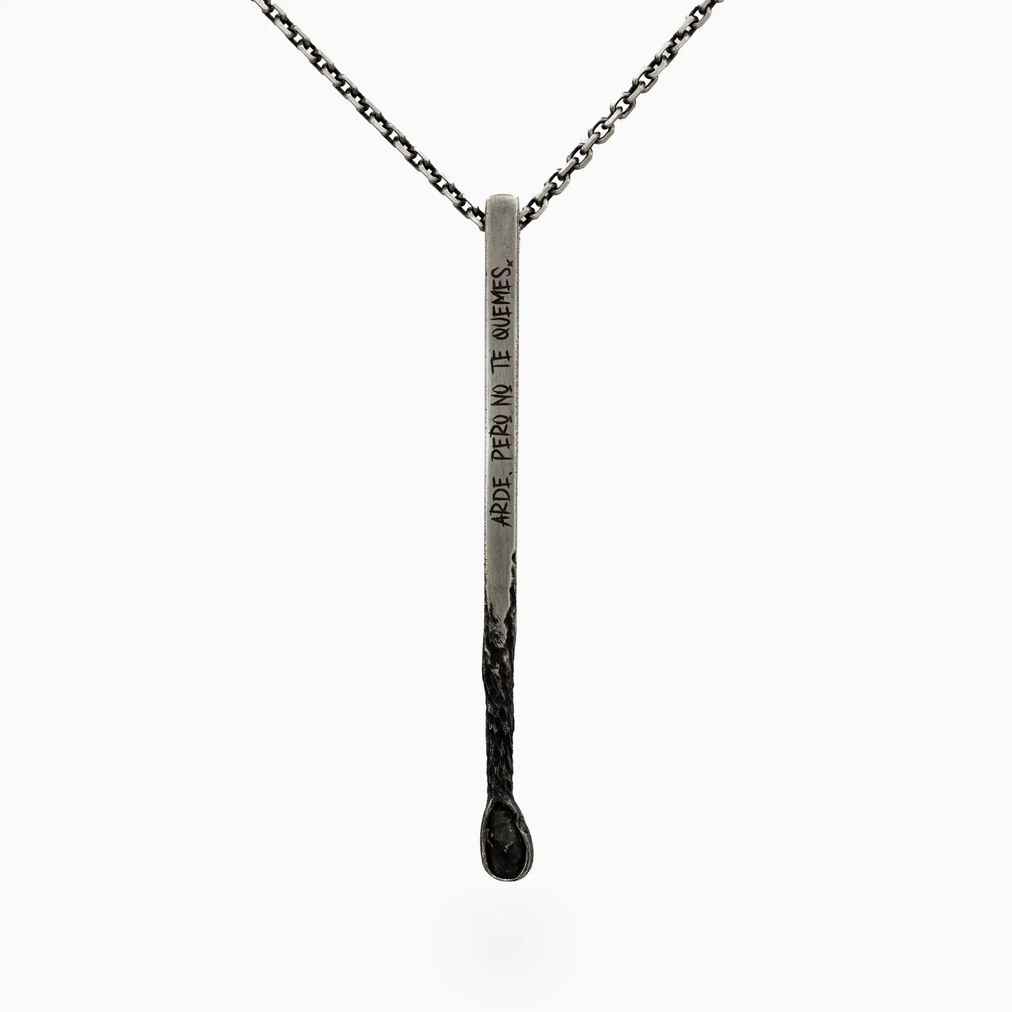 Silver matchstick-shaped pendant with engraved text, symbolizing fire and passion.