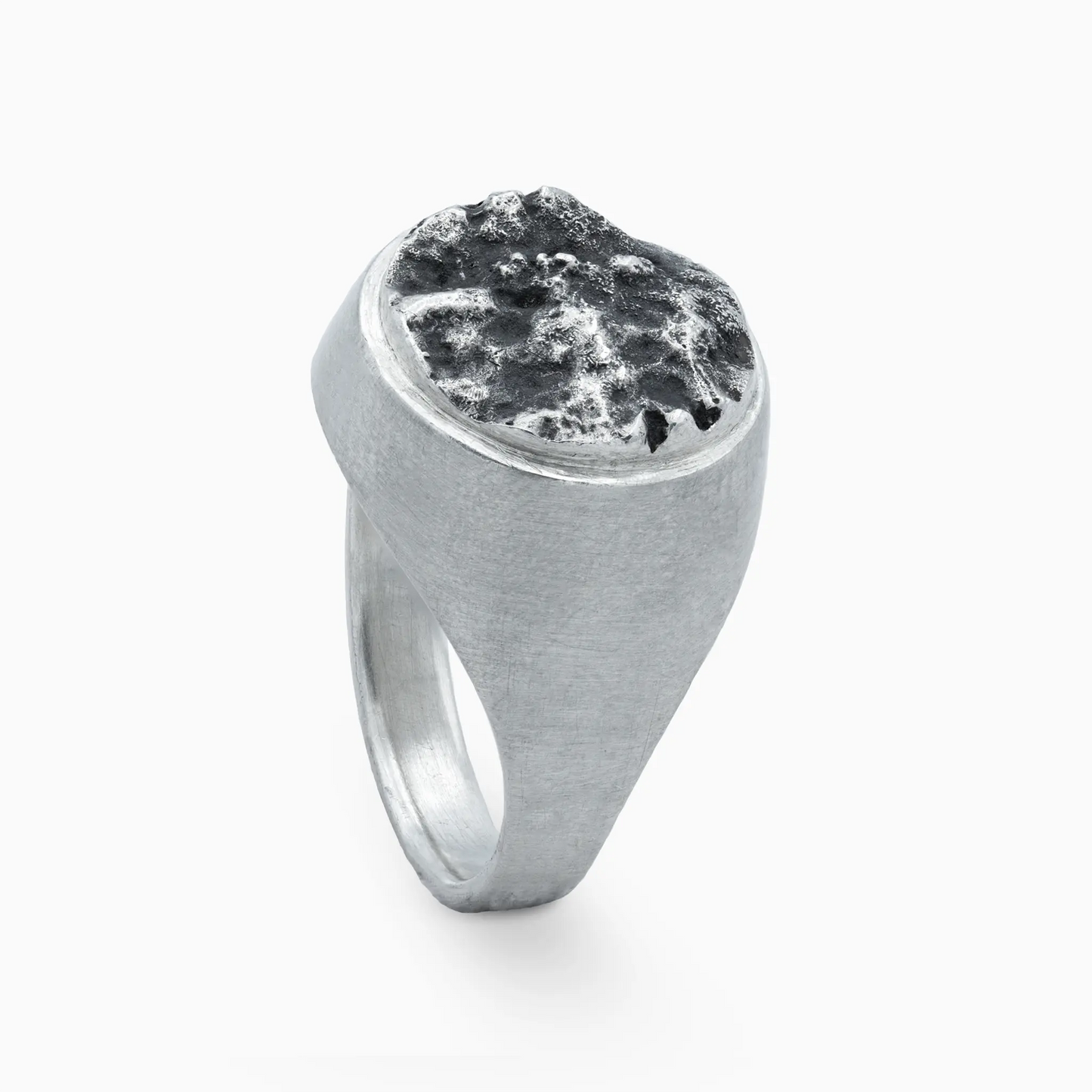 Sterling Silver silver ring with a rugged textured top, inspired by lunar landscapes.
