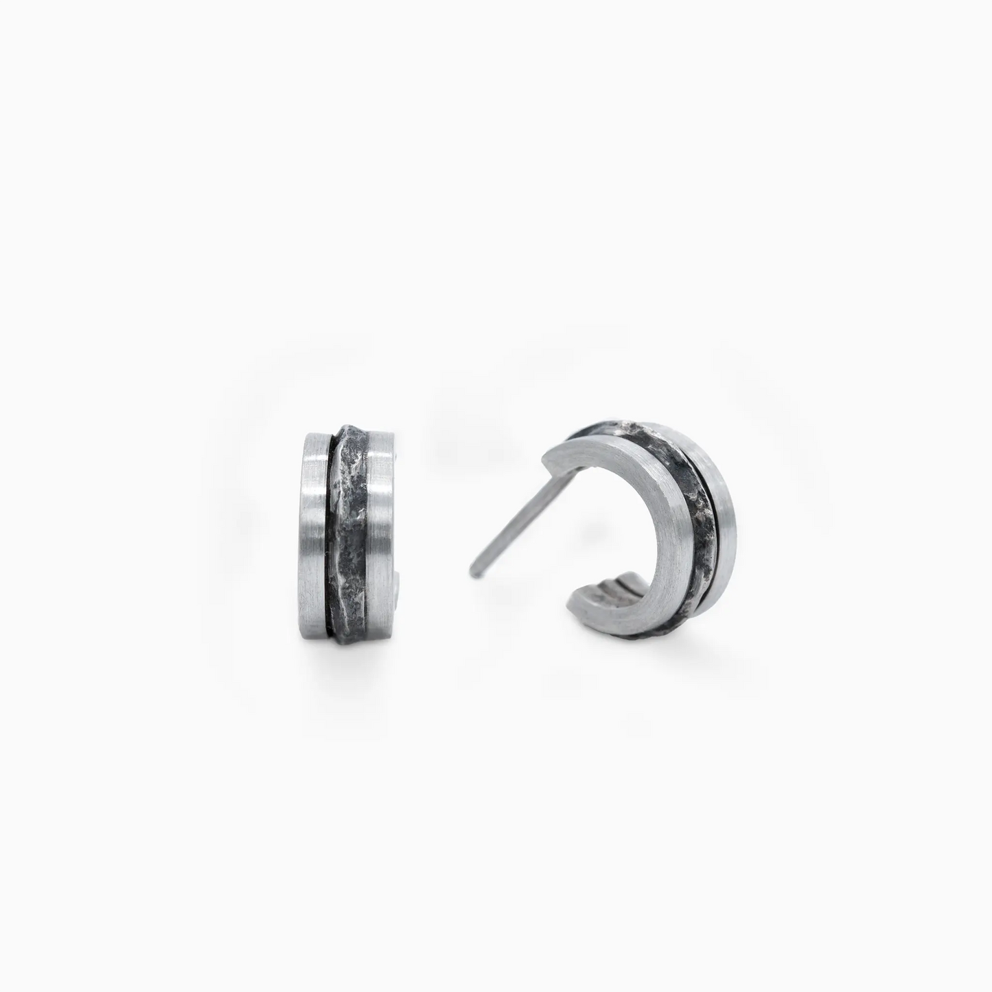 Sterling Silver silver hoop earrings with rugged, textured detailing, blending bold and minimalist natural terrain-inspired…