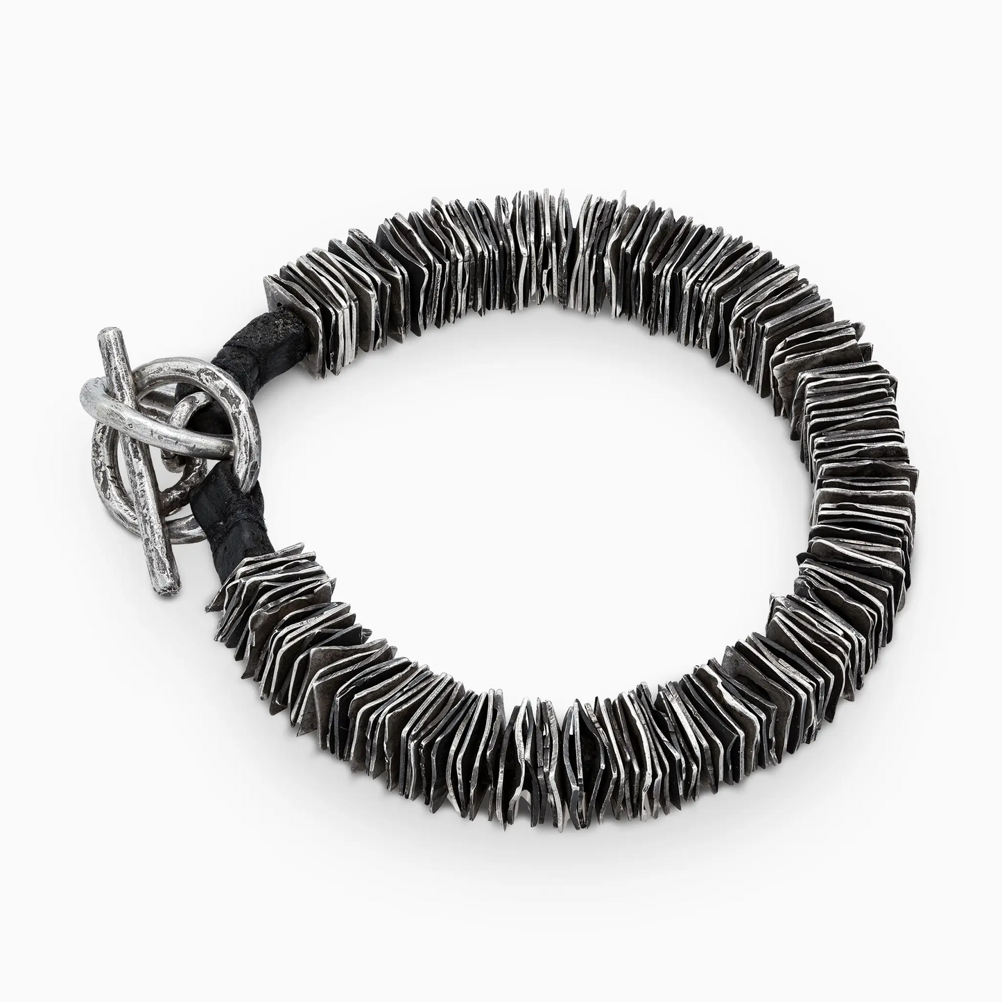 Sterling Silver overhead shot of the 'Plates' bracelet, featuring meticulously crafted layered silver design.