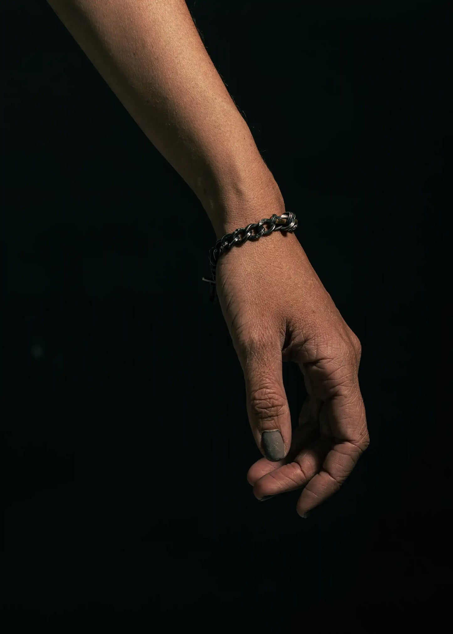 Sterling silver staff and Chain bracelet on a wrist, showcasing bold links and timeless design.