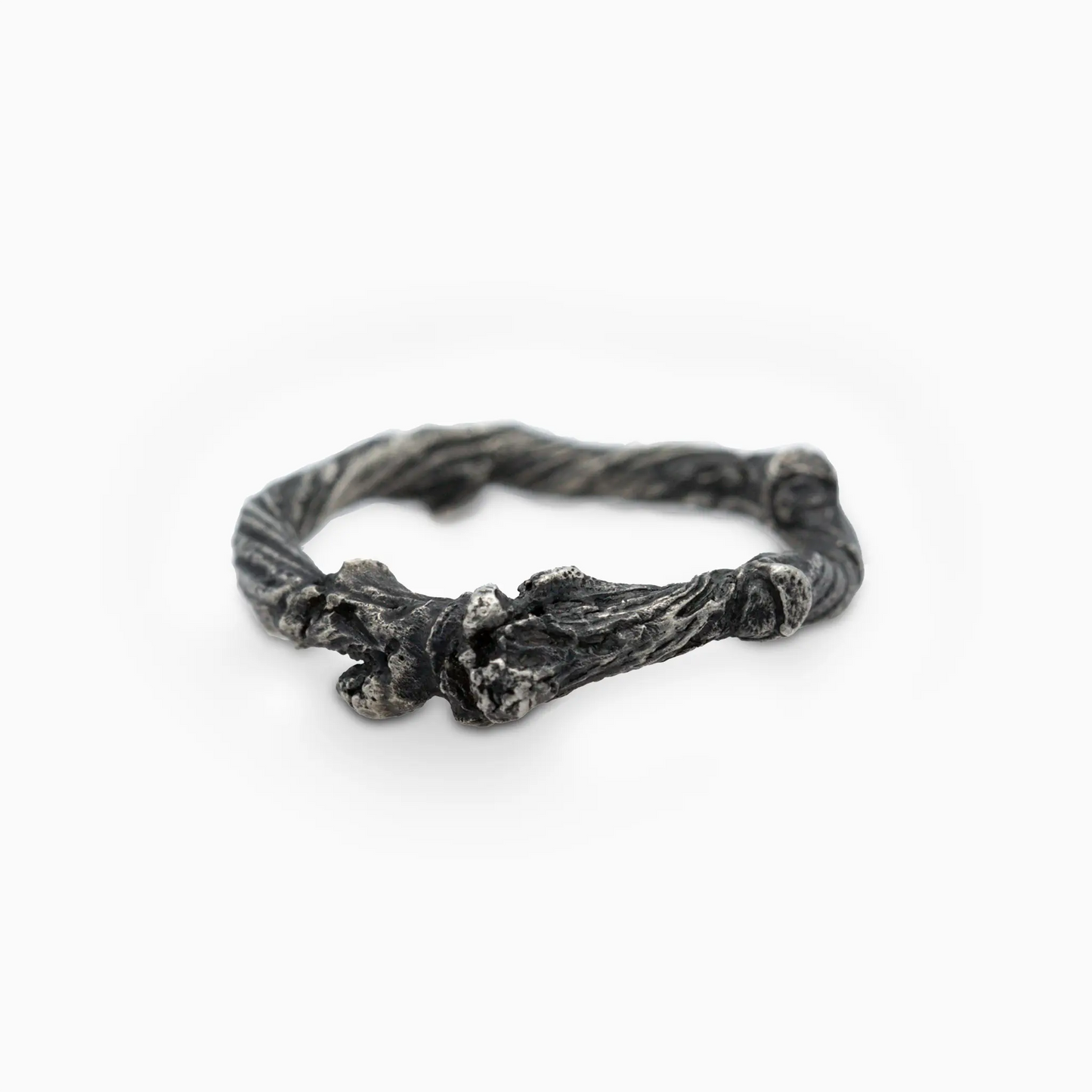 Sterling silver overhead view of a branch-inspired ring with textured design.