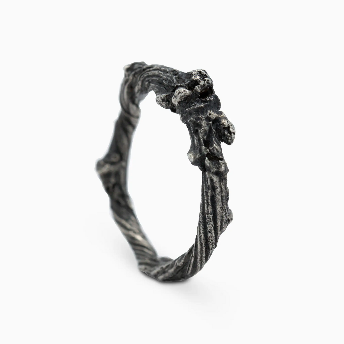 Sterling silver front view of a sculptural twig-like ring with natural grooves, showcasing raw beauty and timeless artistry.