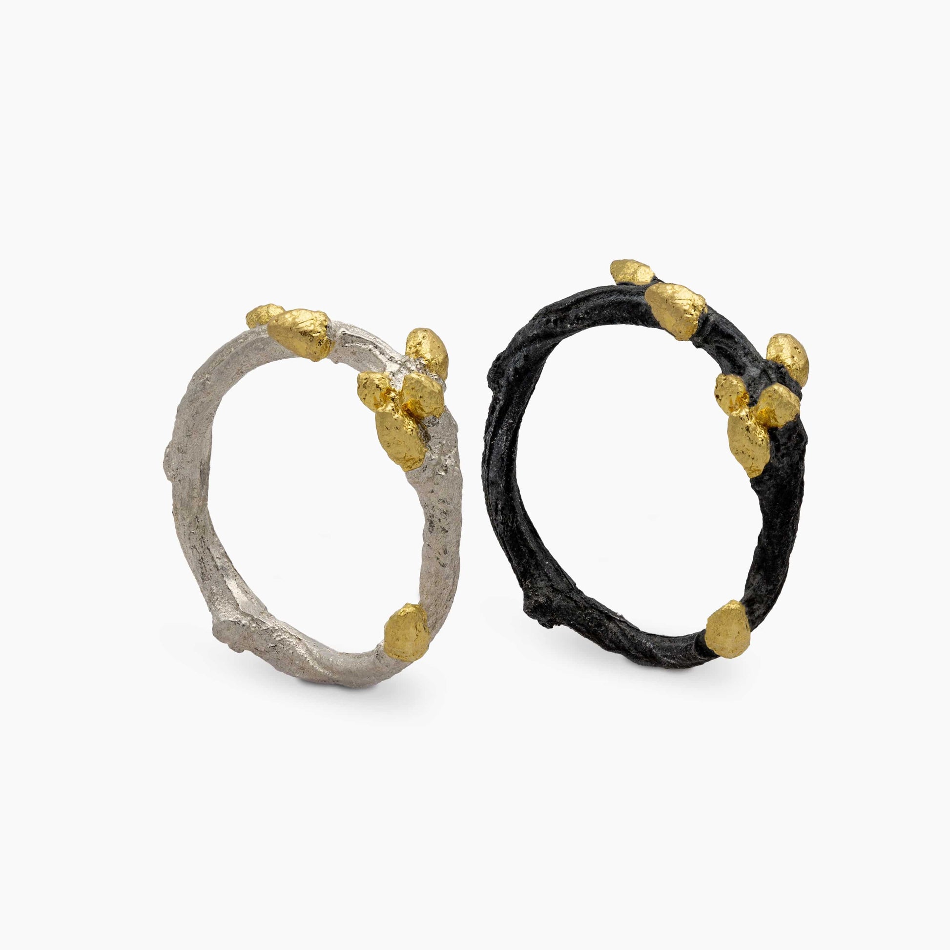 Unique Bonsai rings in sterling silver and black with gold vermeil accents, showcasing a nature-inspired design.