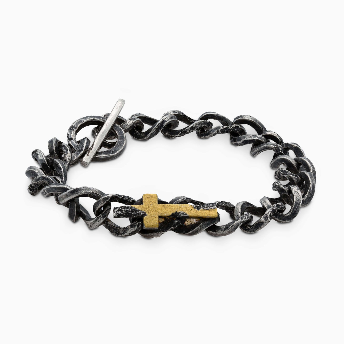 Side profile of an artisanal bracelet featuring bold silver links with a gold covered silver cross, worn elegantly to complement modern style.