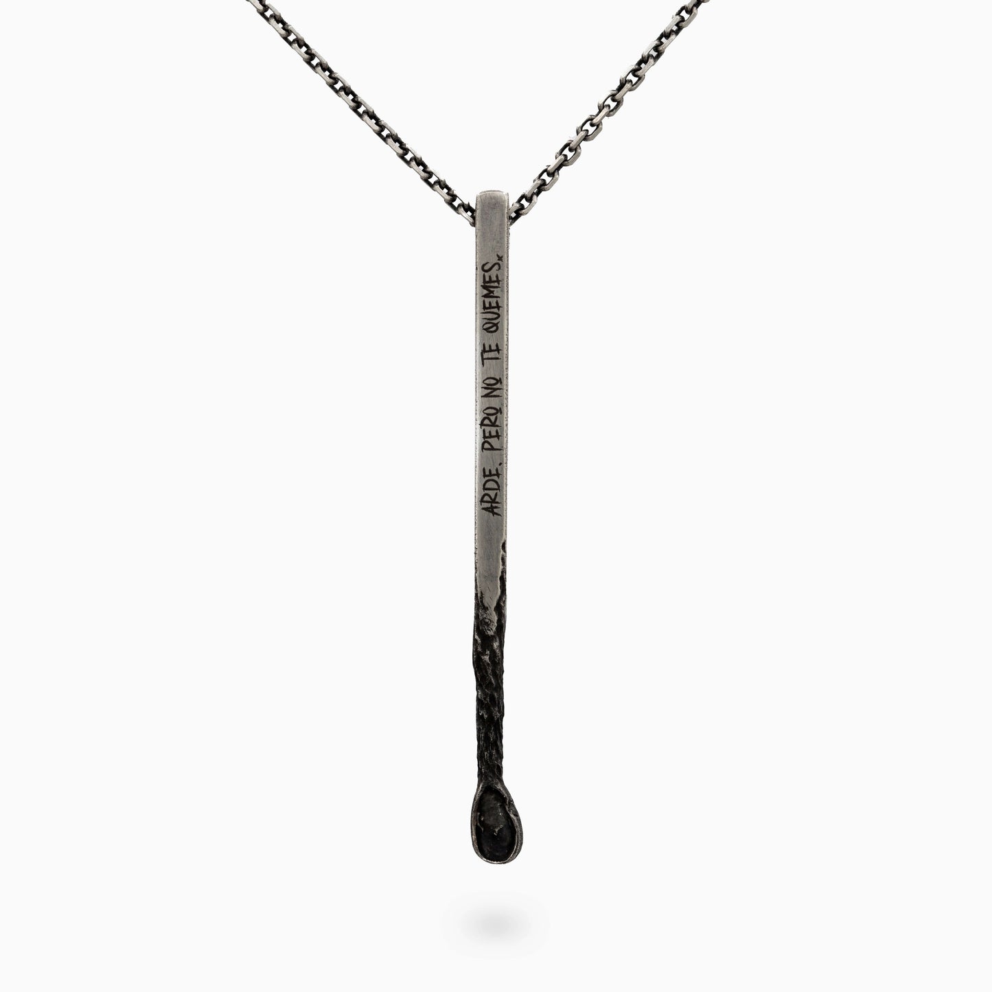 Unique silver pendant resembling a matchstick with engraved text. A bold and meaningful design symbolizing fire and passion.