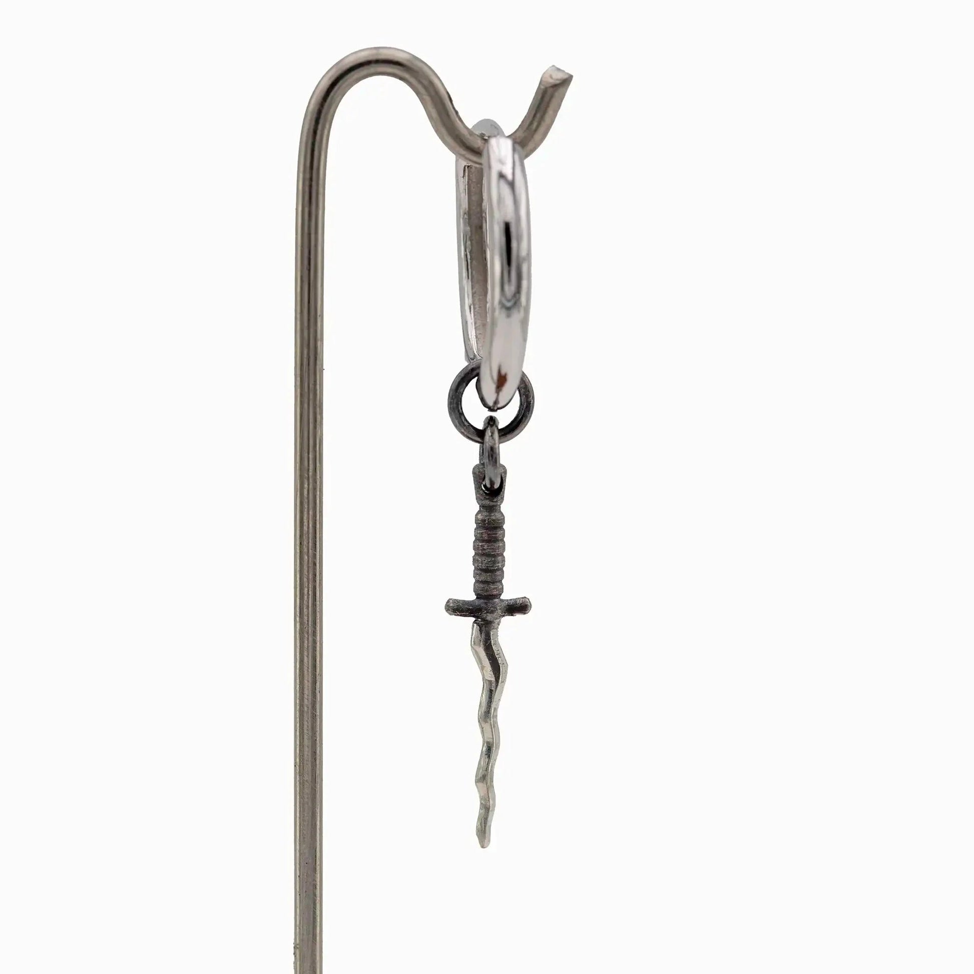 Sterling silver hoop earring with oxidized wavy sword pendant
